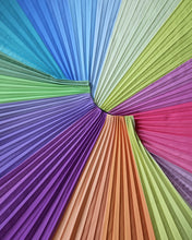 Charger l'image dans la galerie, The mood-boosting, colourful Pastel Skirt laid flat, with pleats fanning in all directions. A shot that shows the full spectrum of shsdes in this joyful multicolour design.