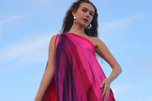 Load image into Gallery viewer, Woman wearing a pink and purple dress against a blue sky.