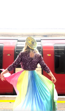 Load and play video in Gallery viewer, Happy customer Twinks twirls joyfully in her new pastel skirt, revealing it's many uplifting colours, pleats and a-line silhouette. She styles beautifully it with a sequin top and hat from her own wardrobe.