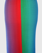 Charger l'image dans la galerie, Close-up of the KittyJoseph Parrot Dress featuring fine crystal pleats in vibrant red, green, and blue optical print.
