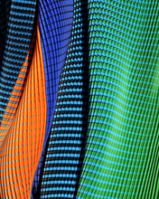 Charger l'image dans la galerie, Close-up of KittyJoseph Parrot Dress fabric showing vibrant green, orange, and blue crystal pleats with optical print.
